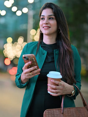 Woman holding orange slice, representing tooth enamel protection